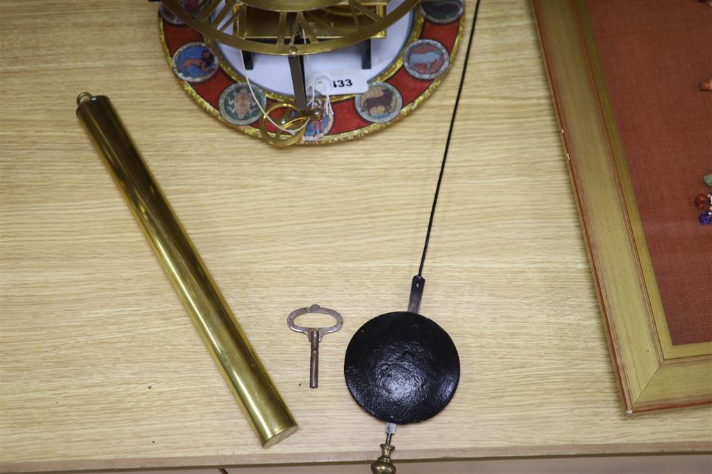 A brass skeleton wall timepiece stamped Bell Bros. Bristol